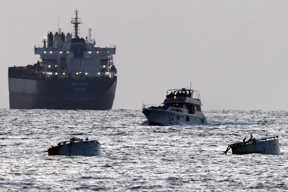 Israeli soldiers aboard a ship bearing the emblem of the Global Freedom Flotilla. A cargo ship is visible in the background. Ashdod, Southern Israel. May 19, 2026. Photo: Reuters.