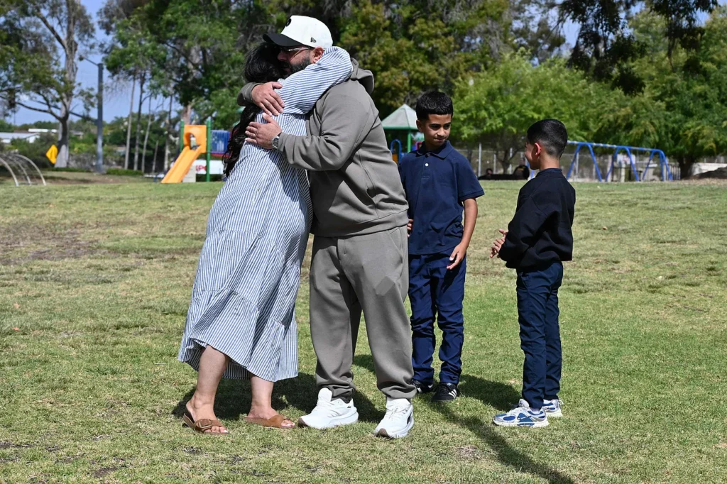 Law enforcement agencies conducted a rescue operation following a gun attack at a mosque in San Diego, California. Meanwhile, relatives waiting at a corner of Lindbergh Park—located near the scene of the incident—were overcome with emotion upon being reunited with their loved ones. May 18, 2026. Photo: AFP