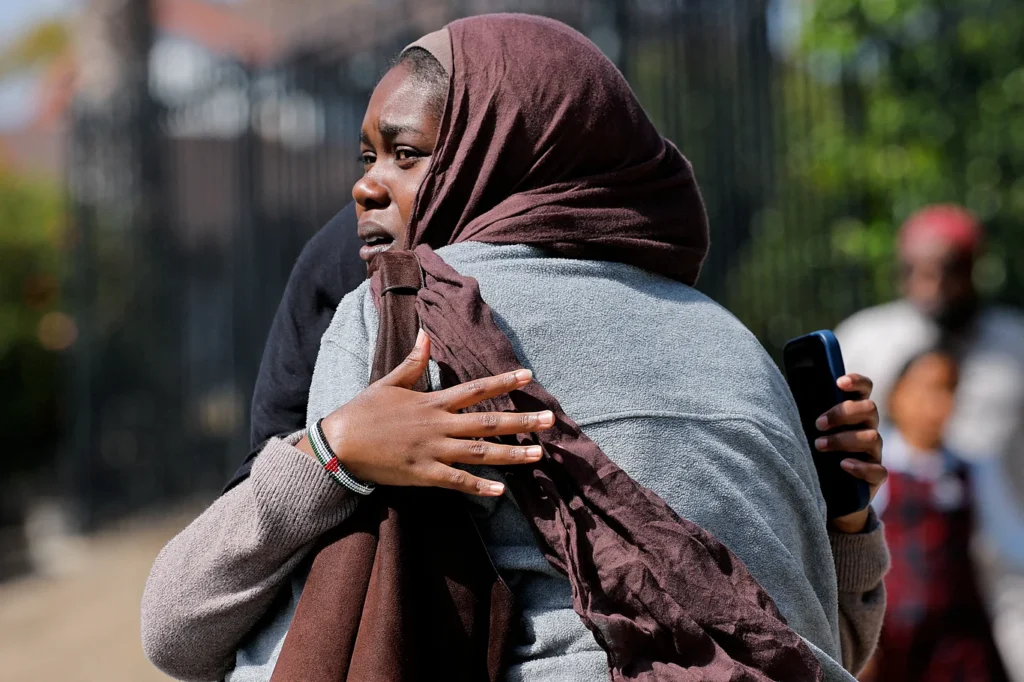 In San Diego, California, USA, several women await the children emerging from a mosque following a shooting incident at the Islamic Center. May 18, 2026. Photo: Reuters.