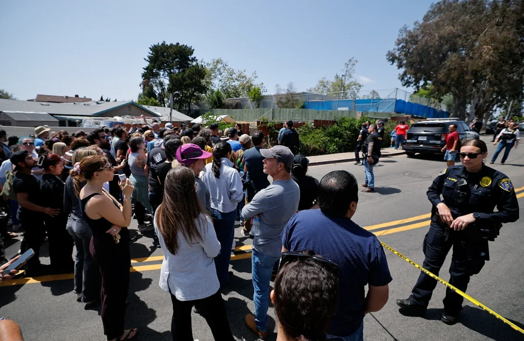 Emergency responders cordoned off the scene in San Diego, California, after receiving reports of a gun attack at an Islamic center. Meanwhile, parents waited near the site for their children to emerge from a nearby school.