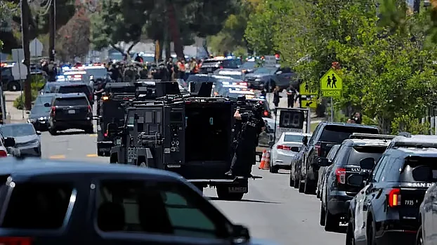 Police take up a precautionary stance following a shooting incident at an Islamic center. San Diego, California, USA; May 18, 2026. Photo: Reuters.
