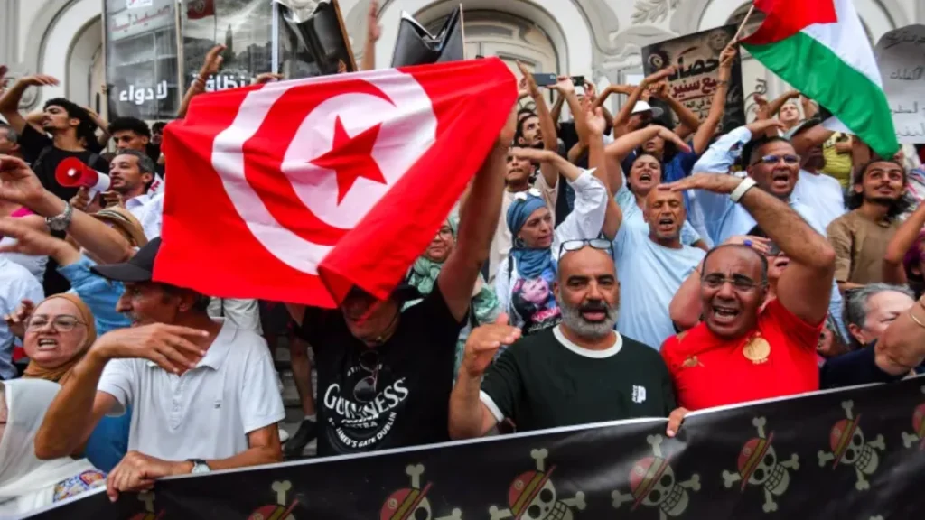 People gathered on Tunis's Habib Bourguiba Avenue for a protest marking the fifth anniversary of the declaration of a state of emergency (July 25, 2026) and demanding the suspension of the parliament by President Kais Saied.