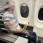 Emergency landing after passenger taped up mid-air